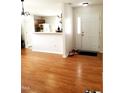 Inviting living space with wood floors, leading into the kitchen with an open, connected layout at 631 Natalie Dr, Graham, NC 27253