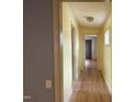 Hallway features laminate floors, light fixtures, and multiple doorways at 731 Latimer St, Hillsborough, NC 27278