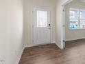 Inviting entryway featuring a decorative glass front door and hardwood flooring at 83 Paper Birch Way, Fuquay Varina, NC 27526
