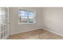 Well lit office space with hardwood floors, white trim and a window to the outside at 83 Paper Birch Way, Fuquay Varina, NC 27526