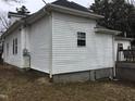 View of side exterior; shows the siding and window; part of a deck is visible in the image at 925 Harris St, Burlington, NC 27217