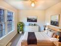 Bright bedroom with a ceiling fan, large window, and neutral decor perfect for relaxation at 1125 Field Meadows Dr, Zebulon, NC 27597
