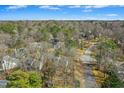 Aerial view showcasing a neighborhood with tree coverage at 201 N Knightsbridge Rd, Cary, NC 27513