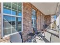Comfortable front porch with seating, offering a relaxing outdoor space at 2220 Stillness Pond Ln, Apex, NC 27539