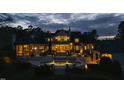 Stunning twilight view of the backyard featuring a pool and lighted outdoor bar, creating a peaceful oasis at 266 Perfect Moment Dr, Durham, NC 27713