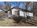 This charming home featuring a light exterior and a cozy front porch, presents an inviting and classic curb appeal at 309 Cody St, Durham, NC 27703