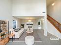 Bright living room with a soaring ceiling and modern decor at 4 Birkdale Ct, Durham, NC 27713