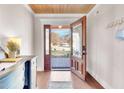 Inviting foyer with hardwood floors and a wooden ceiling with a beautiful outdoor view at 606 E Mason St, Franklinton, NC 27525