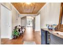 Long foyer boasts hardwood floors, detailed ceilings, and arched doorways leading to bright spaces at 606 E Mason St, Franklinton, NC 27525