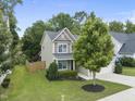 View of charming home and surrounding lawn and landscaping at 622 Lone Pine Loop, Fuquay Varina, NC 27526