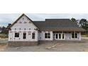 New construction home shows brick foundation, covered patio and quality framework at 6312 River Rd, Fuquay Varina, NC 27526