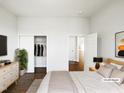 Bright bedroom featuring a spacious closet and an open doorway leading to other parts of the home at 9100 Palm Bay Cir, Raleigh, NC 27617
