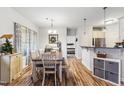 Bright dining area with an inviting table and seating, seamlessly connected to the kitchen space at 10923 Selma Rd, Middlesex, NC 27557