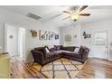 Cozy living room featuring a comfortable sectional sofa, decorative rug, and bright natural light at 10923 Selma Rd, Middlesex, NC 27557