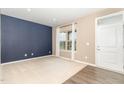 Cozy living room featuring a neutral color scheme, plush carpeting, ample natural light, and a modern interior door at 121 Mason Oaks Dr, Wake Forest, NC 27587
