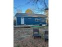 Backyard featuring a deck, partial fencing, and mature trees at 206 Justice Heights St, Apex, NC 27502