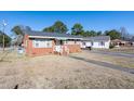 Cozy brick house with white trim, an awning, and a well-kept lawn at 2608 Walley St, Rocky Mount, NC 27803