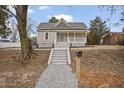 Home features well-maintained landscaping, a covered porch, and a convenient mailbox at 408 Charlotte Ave, Sanford, NC 27330