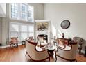 Elegant living room features a fireplace, hardwood floors, and refined decor, creating a comfortable atmosphere at 500 Chandler Grant Dr, Cary, NC 27519