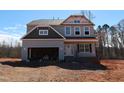 New construction home with gray siding, awaiting final touches at 5372 Salem Woods Dr # 18, Graham, NC 27253
