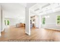 Open concept living area showing hardwood floors and coffered ceilings at 5372 Salem Woods Dr # 18, Graham, NC 27253