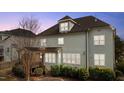 A spacious outdoor wooden deck and lush green landscape enhance the backyard view at 6205 Roles Saddle Dr, Rolesville, NC 27571