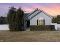 Charming single-Gathering home featuring a well-maintained yard and attractive exterior details at 103 Poplar Dr, Clayton, NC 27520