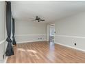 Spacious living room with hardwood floors and a ceiling fan at 103 Poplar Dr, Clayton, NC 27520
