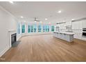 Bright living area featuring fireplace, open dining area and kitchen with stainless appliances at 10330 Sablewood Dr # 103, Raleigh, NC 27617