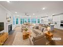 Bright, virtually staged living area, showcasing fireplace, open dining area and kitchen with updated appliances at 10330 Sablewood Dr # 103, Raleigh, NC 27617