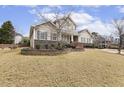 Beautiful home boasting a well-kept lawn and stone landscaping, creating a welcoming curb appeal at 115 Vintage Hill Cir, Apex, NC 27539