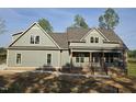 Beautiful new construction home with a welcoming porch and a classic craftsman-style design at 2833 Faucette Ln, Burlington, NC 27217