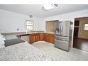 Bright kitchen featuring stainless steel appliances, granite countertops and modern fixtures at 300 W Carr St, Mebane, NC 27302