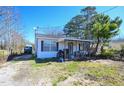 Exterior view of single-story home with front porch at 407 Iris Bryant Rd, Dunn, NC 28334