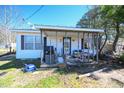 This is a close up of the front porch and address at 407 Iris Bryant Rd, Dunn, NC 28334