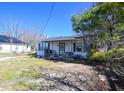 Quaint single-story home with a covered front porch, showcasing the exterior at 407 Iris Bryant Rd, Dunn, NC 28334
