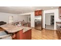 Spacious kitchen features stainless steel appliances, granite countertops, and a convenient island at 604 S Chavis St, Franklinton, NC 27525