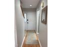 Inviting entryway featuring hardwood floors, neutral paint, and contemporary decor at 704 Martin Luther King Jr Blvd # D12, Chapel Hill, NC 27514
