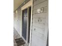 View of front door displaying unit number with adjacent wooden porch at 704 Martin Luther King Jr Blvd # D12, Chapel Hill, NC 27514