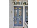 Stylish blue double doors with glass panes create an inviting entryway at 712 Tarleton Ave, Burlington, NC 27215