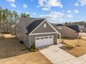 Attractive single-Gathering home features a two-car garage and well-maintained landscaping at 1254 White Flint Cir, Durham, NC 27703