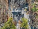 Aerial view of the property showcasing its location and surrounding landscape with backyard at 2107 Spring Ln, Sanford, NC 27330