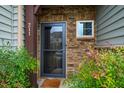 Charming front entrance with stone accents and neat landscaping at 211 Monarda Way, Hillsborough, NC 27278