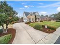 Beautiful traditional home featuring a long driveway and well-maintained landscaping at 2639 Bowden Dr, Creedmoor, NC 27522