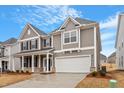 Attractive two-story home with a two-car garage and classic architectural details at 3016 Dog Rose Dr # 303, Durham, NC 27703