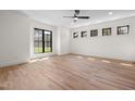 Bright and airy bedroom with large windows and hardwood floors showcases the room's spaciousness at 3601 Bivins Rd, Hillsborough, NC 27278