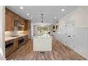 Modern kitchen features a large island, stainless steel appliances, and ample cabinet space at 3601 Bivins Rd, Hillsborough, NC 27278