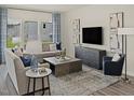Comfortable living room with stylish furniture, a modern entertainment center, and plenty of natural light at 3825 Rosebush Dr, Zebulon, NC 27597