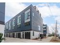 Townhome exterior showcasing garages, modern design, and convenient street access at 5 Seawell Ave # 106, Raleigh, NC 27601