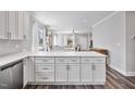 Bright kitchen features white cabinets, stone countertops and stainless steel appliances at 561 Circle Dr, Angier, NC 27501